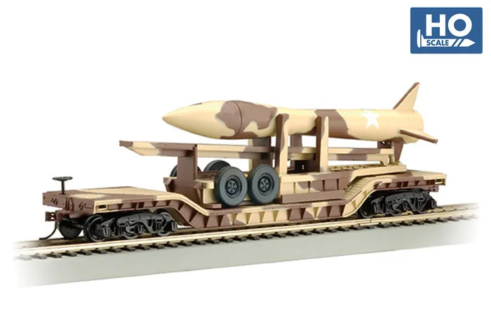 BACHMANN 52FT CENTRE DEPRESSED FLATCAR DESERT CAMO WITH MISSILE. HO SCALE